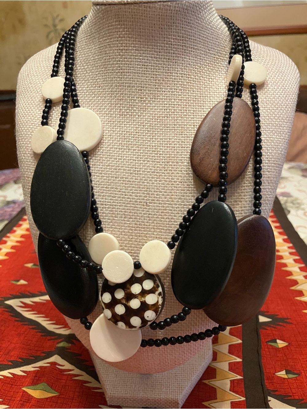 Wooden Disc Necklace
With added white discs and small black beads
